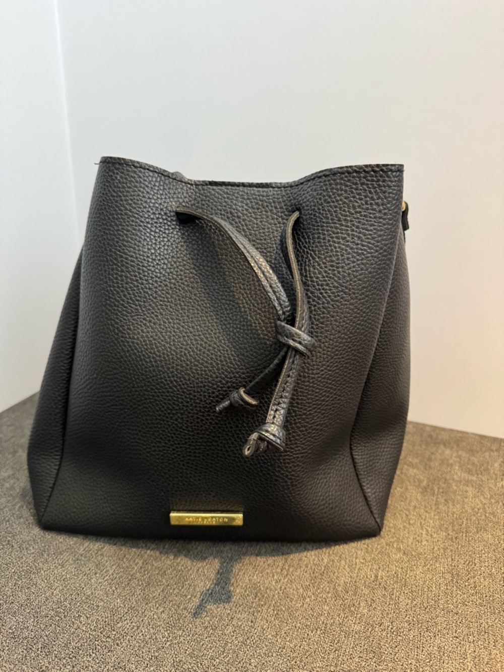 Katie Loxton Black Pebbled Bucket
Bag with Drawstring and Gold Hardware
